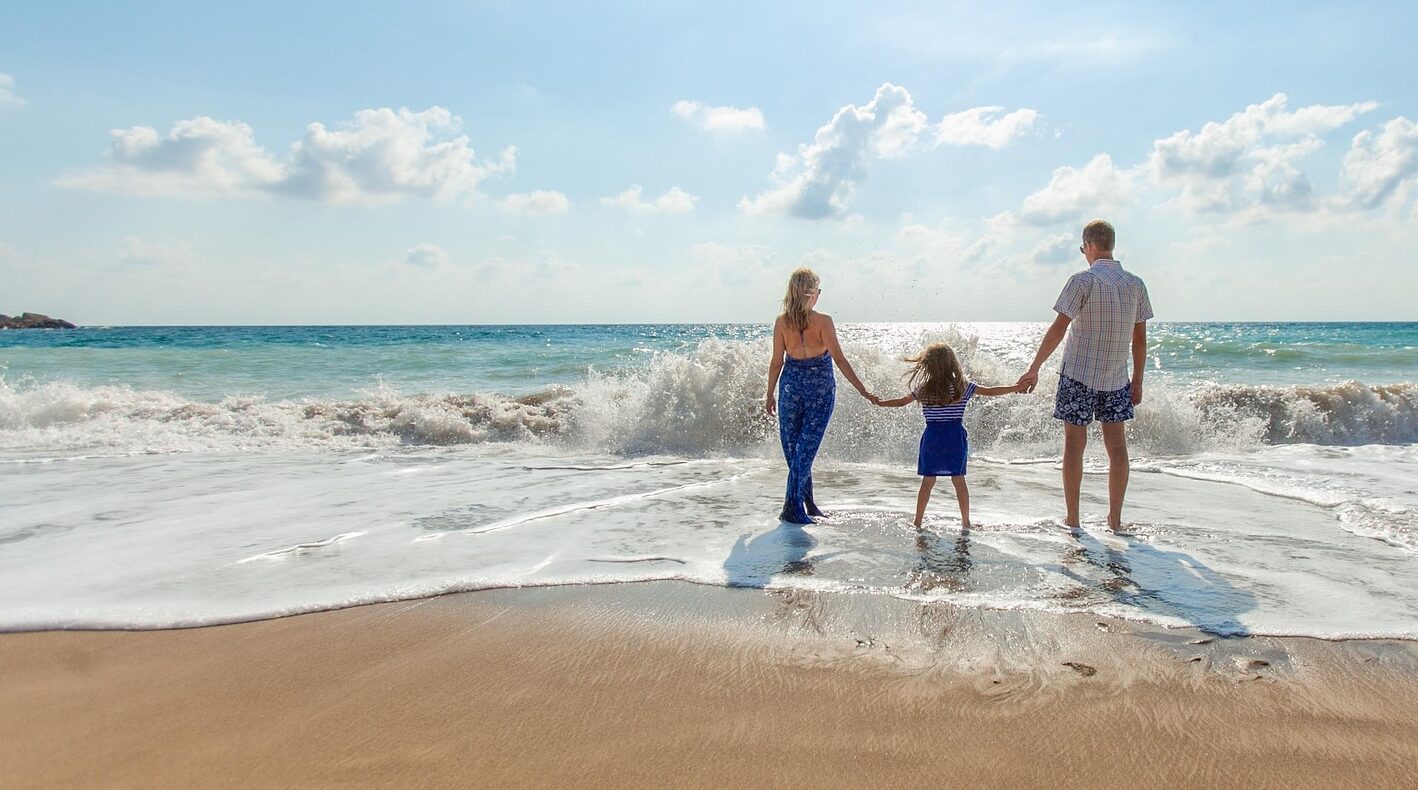 family in Malaga playing on the costa del sol beach